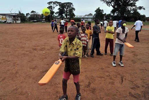 Boys learn to play cricket at Kingtom Oval in Freetown, Sierra Leone's only cricket ground, on November 15, 2012